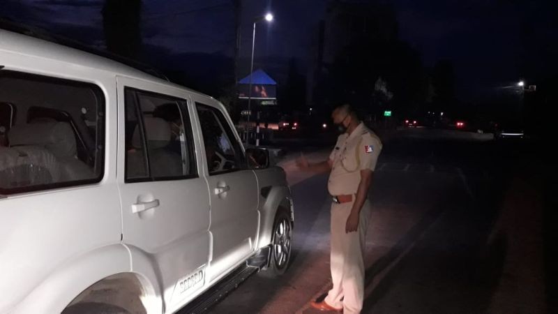 A police officer is seen stopping a vehicle for checking in this photo shared on social media by the Dimapur Police in August 2020. As per the Dimapur police data, the most populous district in Nagaland witnessed a 10% drop in crime incidence in 2020. (File Photo: @dimapurpolice/Twitter)